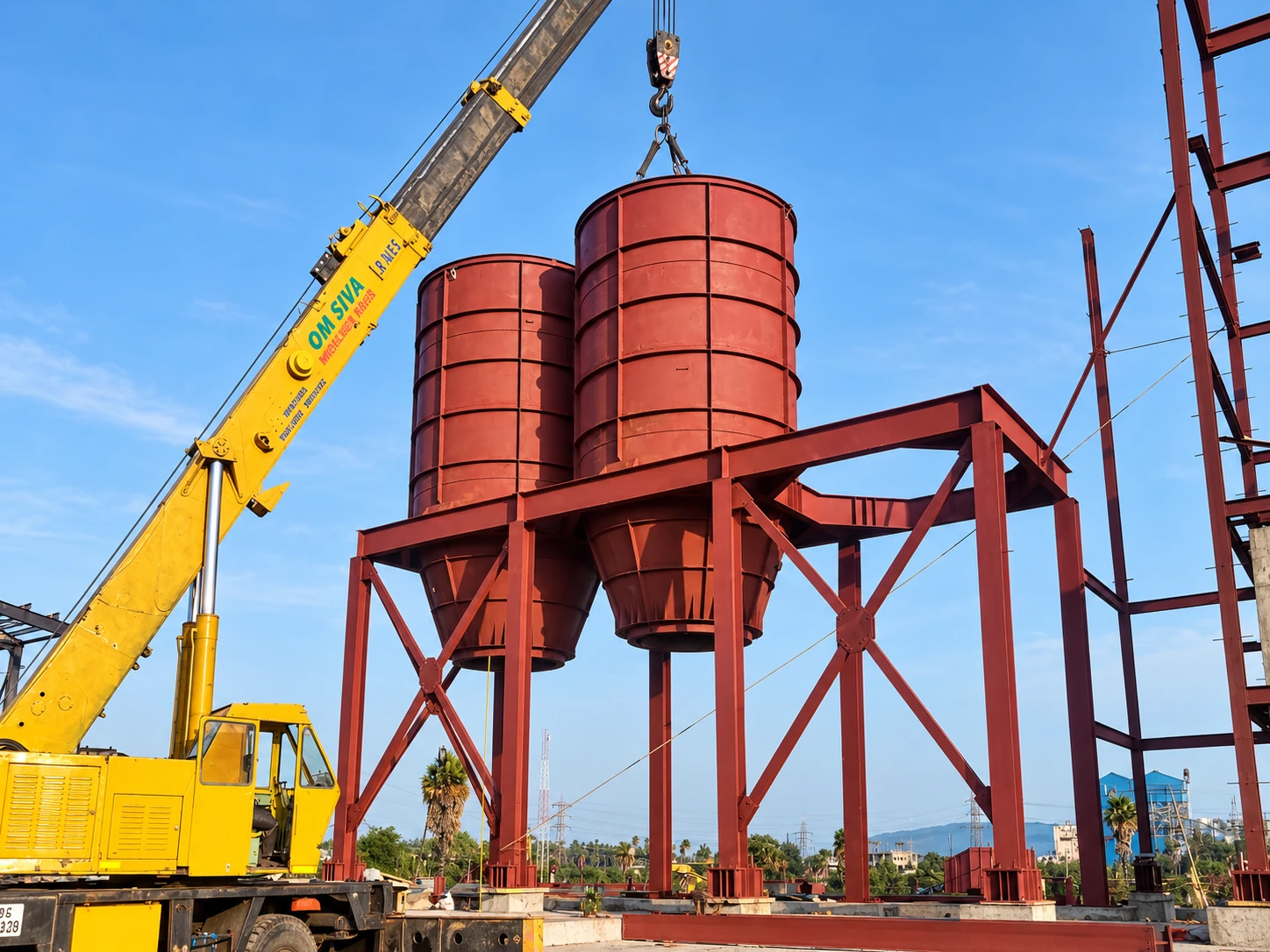 Twin process hoppers being lifted into position at JS Auto Cast Foundry.