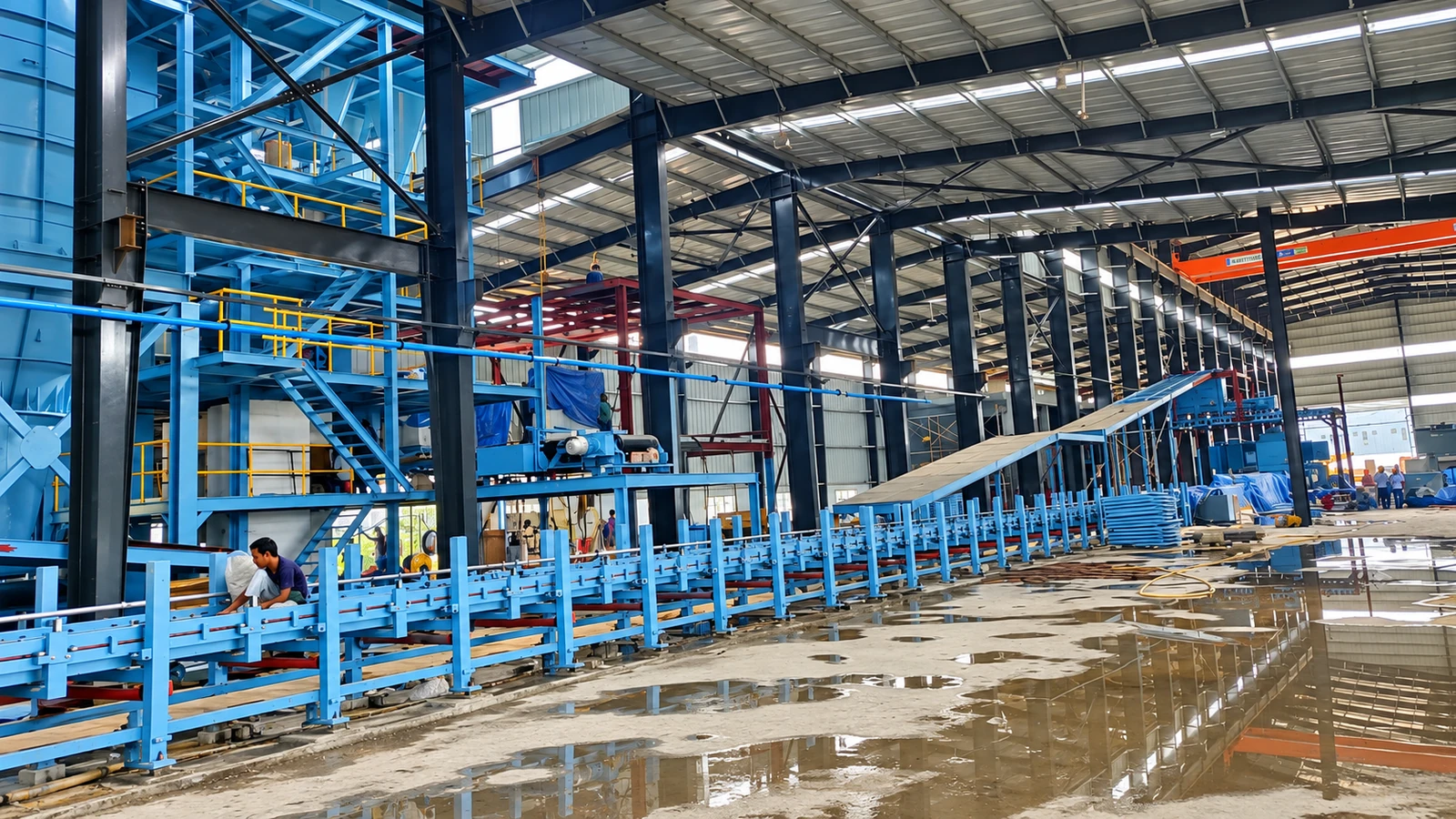 Material-handling conveyor line under installation inside JS Auto Cast Foundry.