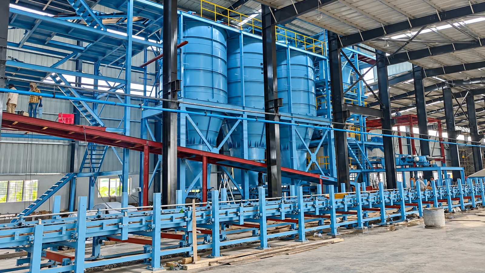 Integrated sand-plant structures and process equipment inside JS Auto Cast Foundry.